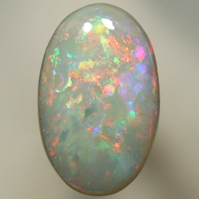 SOLID SEMI BLACK OPAL Bright fire of reds to green to pinky purple. SEE VIDEO